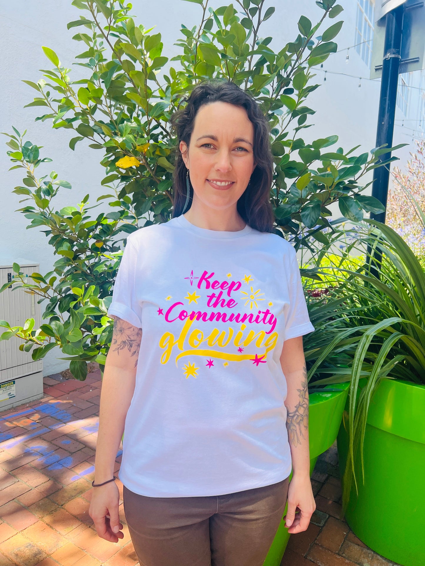 KEEP THE COMMUNITY GLOWING T SHIRT